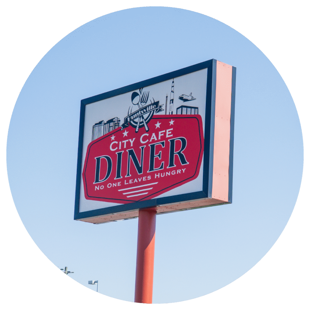 City Cafe Diner sign in Huntsville, Alabama, featuring the slogan “No One Leaves Hungry.”